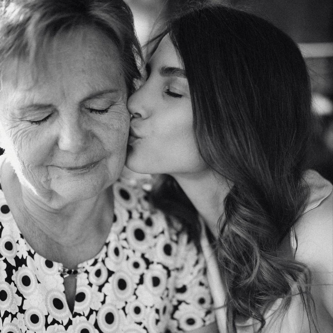 Woman kissing mom - black & white image